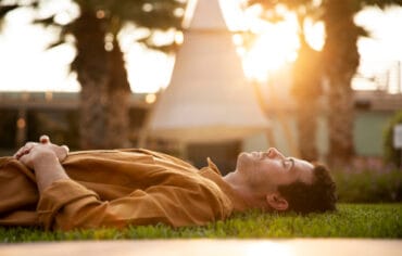 medium shot man laying grass