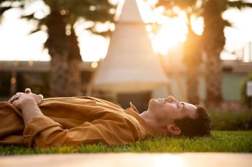medium shot man laying grass